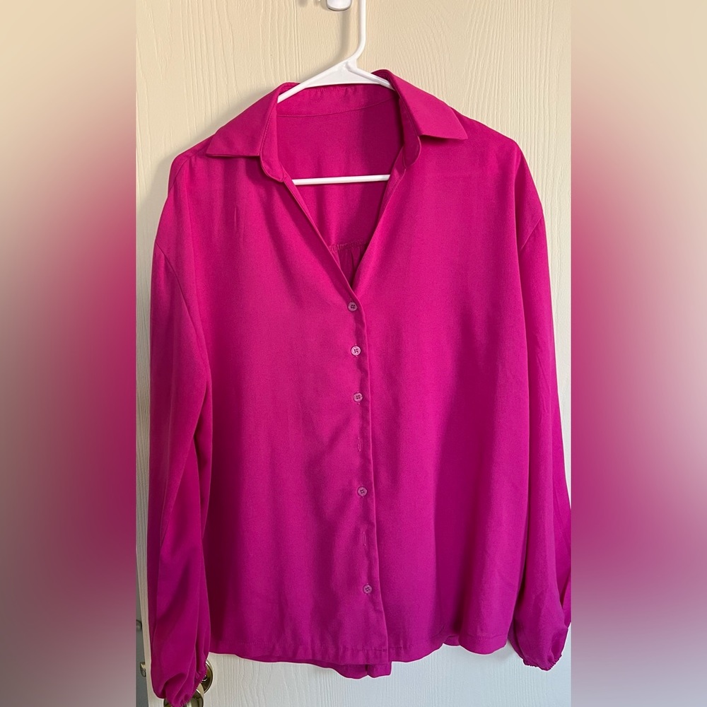 Fuchsia blouse with matching wrap skirt.
